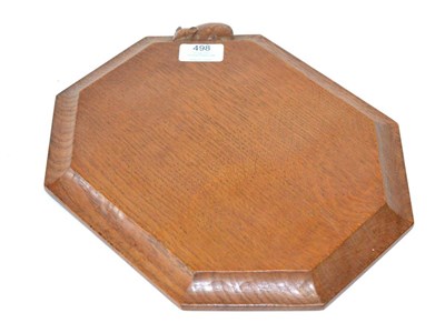 Lot 498 - A Robert  "Mouseman " Thompson Oak Bread Board, with carved mouse signature, 31cm