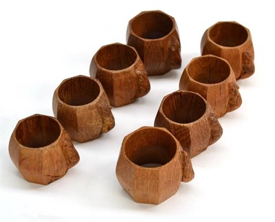 Lot 511 - Eight Robert  "Mouseman " Thompson Oak Napkin Rings, of octagonal form, each with carved mouse...