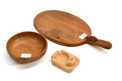 Lot 523 - A Robert  "Mouseman " Thompson Oak Cheese Board, with carved mouse signature on the handle, 40cm; A