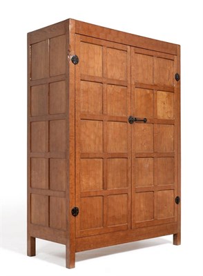 Lot 551 - A Derek  "Lizardman " Slater Oak Panelled Wardrobe, with two doors enclosing a shelf and a...