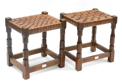 Lot 553 - Two Sid Pollard of Thirsk Oak Stools, both with leather lattice seats, on four octagonal legs...