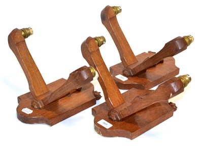 Lot 565 - Three Bob  "Wrenman " Hunter Oak Double Branch Wall Light Brackets, each with carved wren...