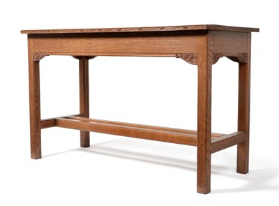 Lot 578 - An Arthur Simpson Oak Rectangular Side Table, the shaped top with carved wave moulding, above...