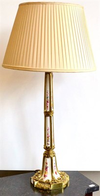 Lot 798 - An Early Victorian Ormolu Mounted Porcelain Lamp Base, the circular weighted base with tong and...