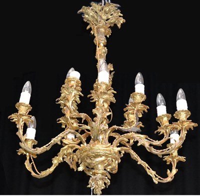 Lot 800 - A 19th Century Gilt Bronze Fifteen-Light Chandelier, of neo-rococo form, the wrythen fluted...