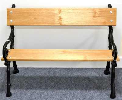 Lot 828 - A Cast Iron Garden Bench, with two naturalistic branch-formed end supports, two modern wooden...