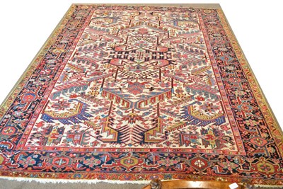 Lot 834 - Heriz Carpet of Unusual Design Persian Azerbaijan The cream field with columns of serrated...