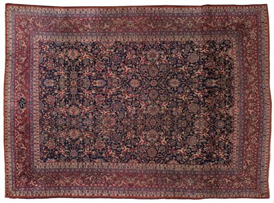 Lot 851 - Unusual Mashad Carpet North East Persia The deep indigo allover lattice vine field of palmettes and