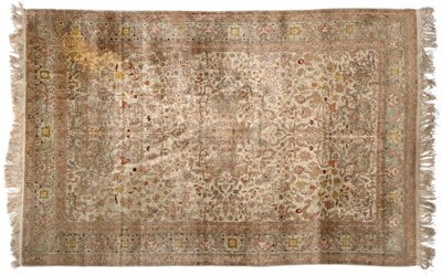 Lot 856 - Probably Hereke? Silk Carpet The ivory ground of scrolling vines around an ice blue medallion famed