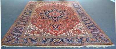 Lot 857 - Ahar Heriz Carpet Persian Azerbaijan The terracotta field of flowering vines around a typical...