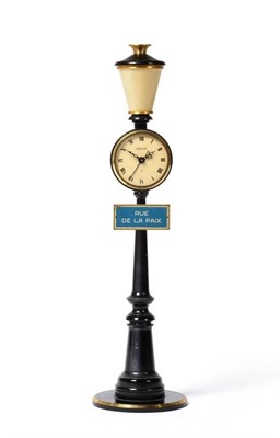 Lot 869 - A Lamp Post  "Rue De La Paix " Alarm Timepiece, signed Jaeger, cream coloured dial with Roman...