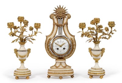 Lot 871 - An Ormolu Mounted White Marble Striking Lyre Mantel Clock with Garniture, circa 1900, surmounted by