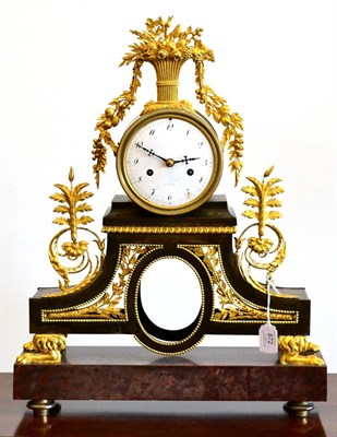 Lot 872 - An Ormolu and Marble Striking Mantel Clock, a Paris, 19th century, surmounted by a vase of flowers