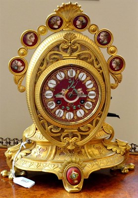 Lot 897 - A Gilt Metal and Porcelain Mounted Striking Mantel Clock, circa 1880, oval shaped case...