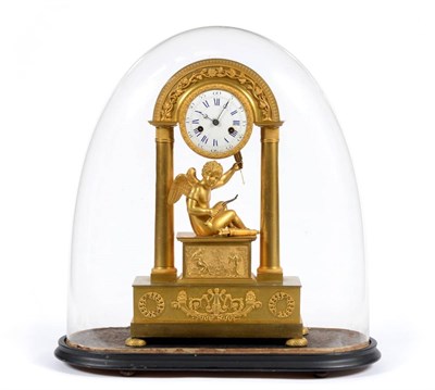 Lot 917 - A Charming Empire Ormolu Striking Mantel Clock, the portico case with a cupid holding a bow and...