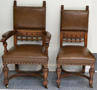 Lot 960 - A Set of Nine Victorian Carved Oak Dining Chairs, late 19th century, upholstered in...