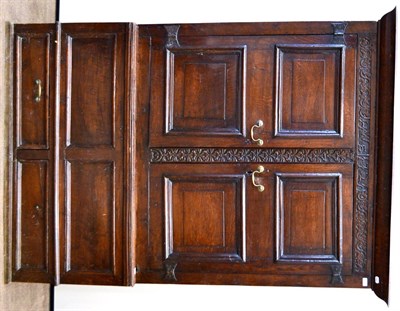 Lot 975 - An English Joined Oak Cupboard, initialled and dated HW 1721, the bold cornice above a carved...