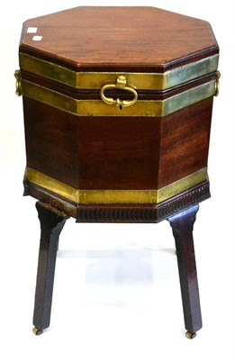 Lot 1012 - A George III Mahogany and Brass Bound Octagonal Wine Cooler, late 18th century, the hinged lid...