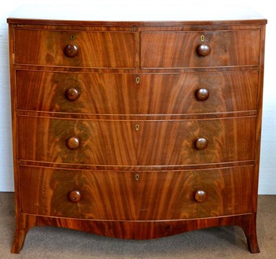 Lot 1018 - A Mid 19th Century Mahogany Bowfront Chest of Drawers, the reeded top above two short and three...