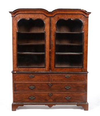 Lot 1028 - An 18th Century Dome Top Bookcase, the later moulded glazed doors enclosing three adjustable...