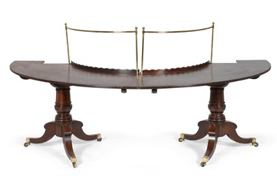 Lot 1032 - A George III Mahogany Drinking or Social Table, early 19th century, of horseshoe shape and in...