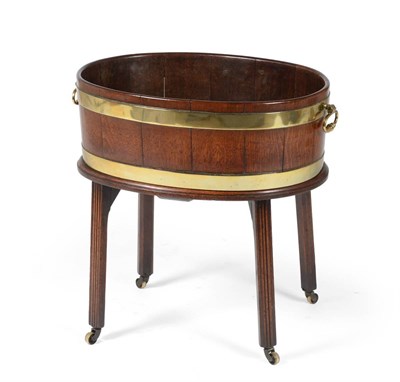 Lot 1045 - A George III Mahogany and Brass Bound Oval Cellaret, late 18th century, of staved construction with