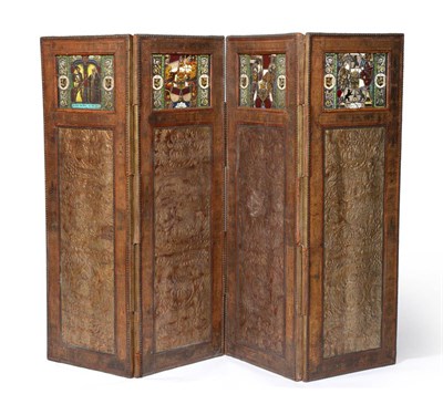 Lot 1071 - A Four Leaf Leather and Parcel Gilt Dressing Screen, circa 1900, containing four leaded glass...