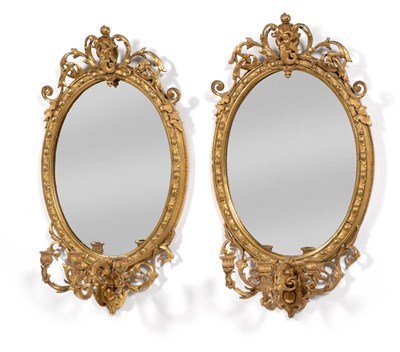 Lot 1088 - A Pair of Regency Gilt and Gesso Three-Branch Girandoles, early 19th century, the oval plates...