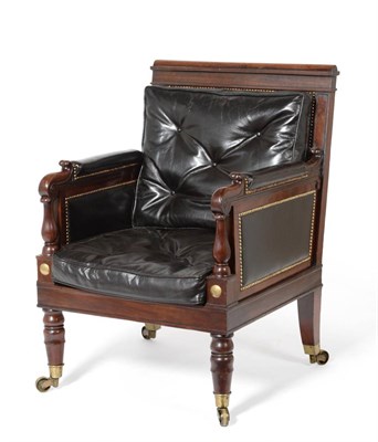 Lot 1099 - A George IV Carved Mahogany Library Armchair, 2nd quarter 19th century, recovered in black...