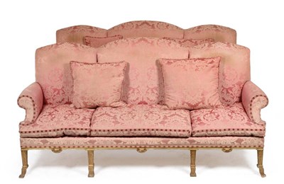 Lot 1109 - A Pair of George III Style Gilt and Gesso Hump Back Sofas, late 19th century, upholstered in...