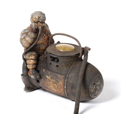 Lot 2013 - A Michelin Tyre Compressor, in the shape of an artillery shell surmounted by a painted cast...