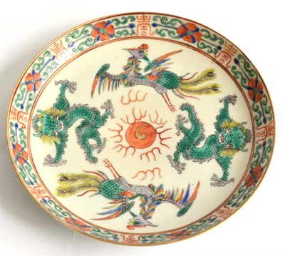Lot 33 - A Chinese Famille Verte Saucer Dish, decorated in typical palette with ho-o birds and dragons, with