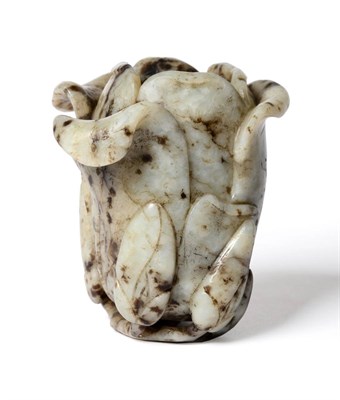 Lot 53 - A Chinese Jade Magnolia Vase, Qing Dynasty, 18th/19th century, naturalistically modelled, the...