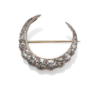 Lot 142 - A Victorian Diamond Crescent Brooch, graduated old cut diamonds in claw settings, total...