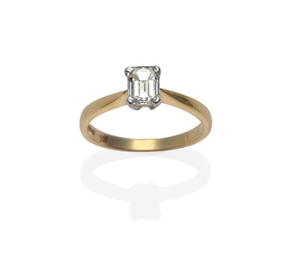 Lot 167 - An 18 Carat Gold Diamond Solitaire Ring, an emerald-cut diamond in a white four claw setting,...