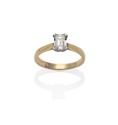 Lot 169 - An 18 Carat Gold Diamond Solitaire Ring, an emerald-cut diamond in a white four claw setting to...