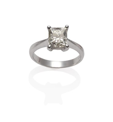 Lot 190 - A Platinum Princess Cut Diamond Solitaire Ring, the diamond in a four claw setting to a tapered...