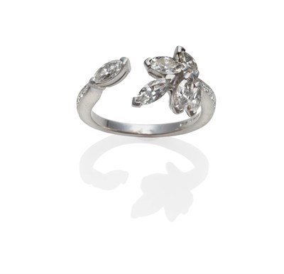 Lot 211 - A Platinum Diamond 'Firefly' Ring, by Boodle & Dunthorne, set with six marquise cut diamonds in...