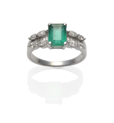 Lot 214 - An Emerald and Diamond Ring, the emerald-cut emerald to shoulders channel set with baguette cut...