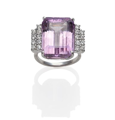 Lot 216 - An 18 Carat White Gold Kunzite and Diamond Ring, an emerald-cut kunzite with two rows of round...