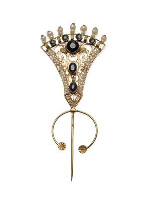 Lot 229 - A Sapphire and Pearl Pin, in a fluted form, inset with round and oval cut blue sapphires, and...