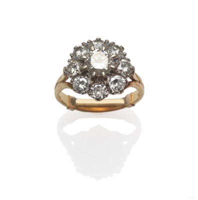 Lot 238 - A Diamond Cluster Ring, a central round brilliant cut diamond surrounded by eight smaller diamonds