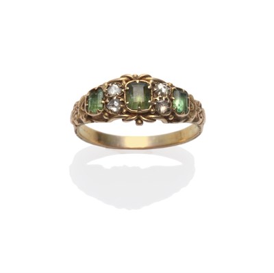 Lot 251 - A Georgian Ring, three green step cut stones spaced by pairs of rose cut diamonds, in yellow...