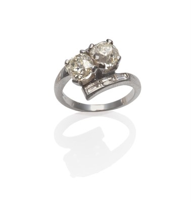 Lot 263 - A Diamond Two Stone Crossover Ring, two old cut diamonds in white claw settings, to shoulders...