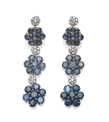 Lot 280 - A Pair of 18 Carat White Gold Sapphire and Diamond Drop Earrings, three clusters of round brilliant