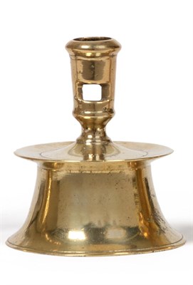 Lot 370 - A 16th Century Brass Capstan Candlestick, probably Low Countries, 1550/80, the incurved base with a