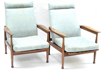 Lot 596 - A 1960's Danish Teak Three Piece Suite, comprising sofa, with upholstered cushions, rubber...