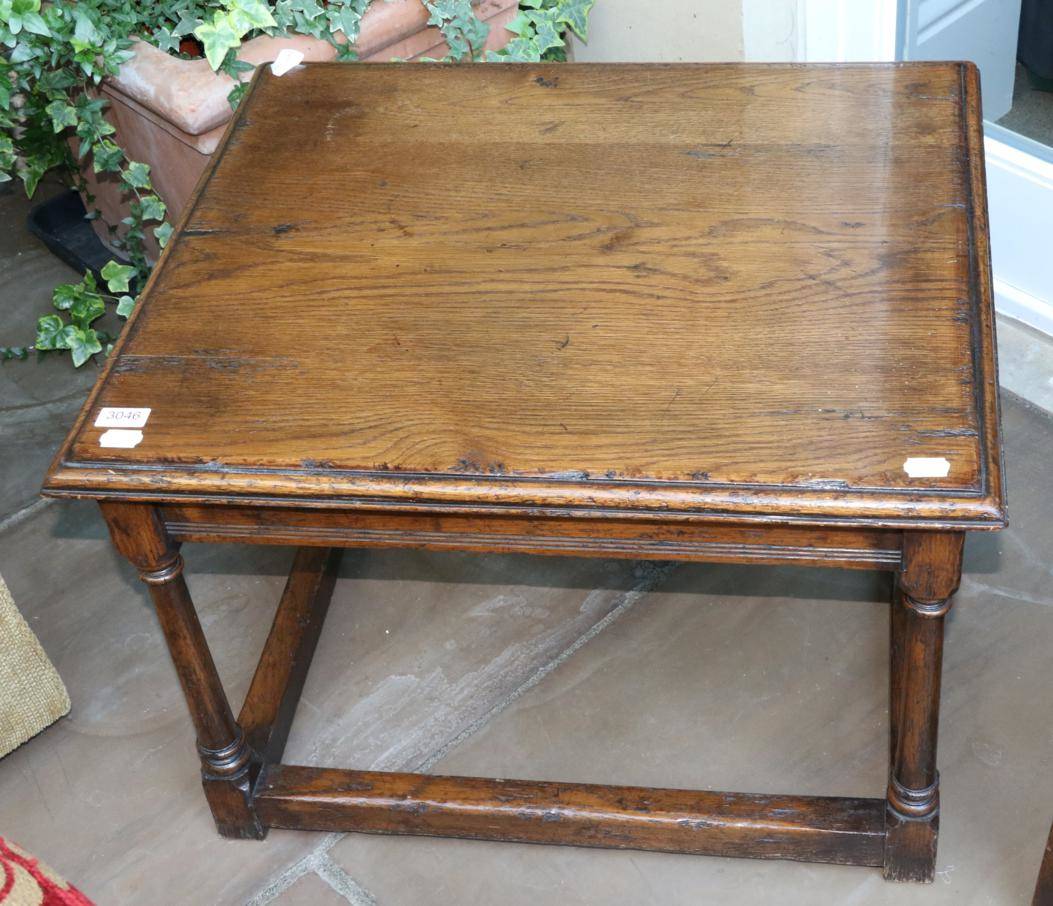 Lot 3046 - A Oak Coffee Table, modern, of rectangular moulded form, raised on gun barrel turned legs joined by