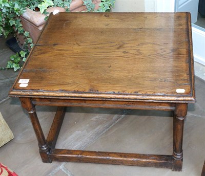 Lot 3046 - A Oak Coffee Table, modern, of rectangular moulded form, raised on gun barrel turned legs joined by
