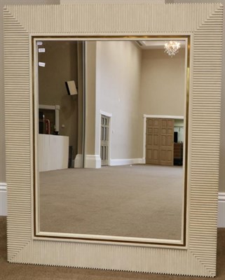 Lot 3070 - A Cream Painted Pine Mirror, 20th century, with geometric reeded frame surrounding a gilt...
